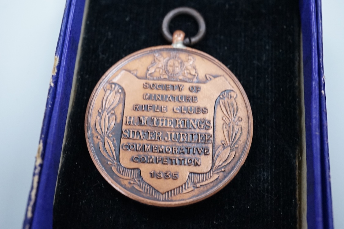A Chinese Wu Pei Fu Sharpshooter enamelled medal, c.1915, with portrait of Wu Pei Fu to the obverse and crossed foliated rifles to the reverse, 40cm diameter